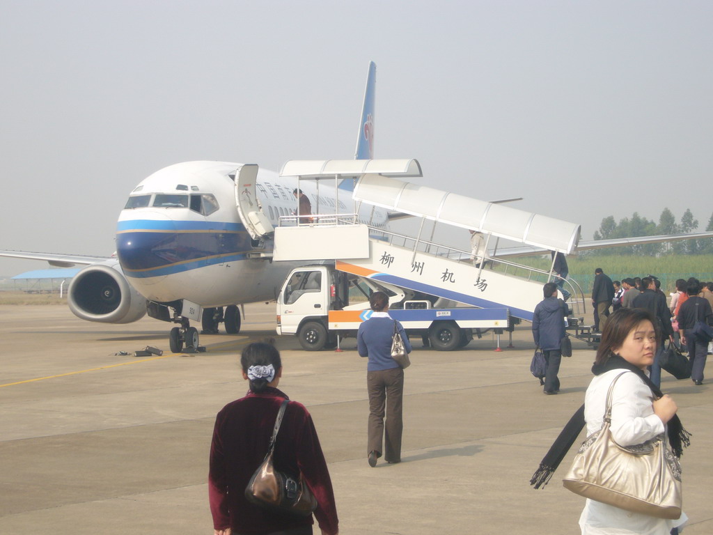 Miaomiao in front of our China Southern airplane to Haikou, at Beijing Capital International Airport