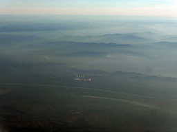 Factory, river and mountains on the west side of the city, viewed from the airplane from Amsterdam