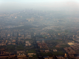 Southeast side of the city with the Laojuntang Park, and skyscrapers in the city center, viewed from the airplane from Amsterdam