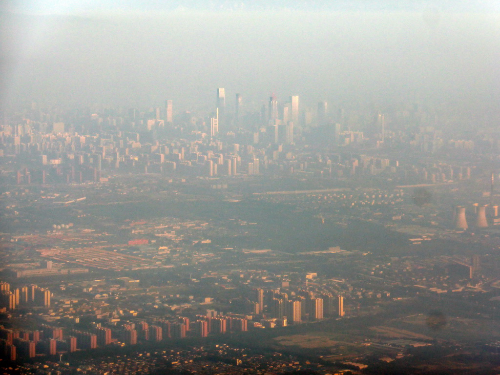 Southeast side of the city and skyscrapers in the city center, viewed from the airplane from Amsterdam