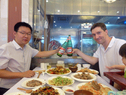 Tim and the husband of Miaomiao`s cousin having Wusu beer in the Kashgar Restaurant at the Pingyuan Hutong alley