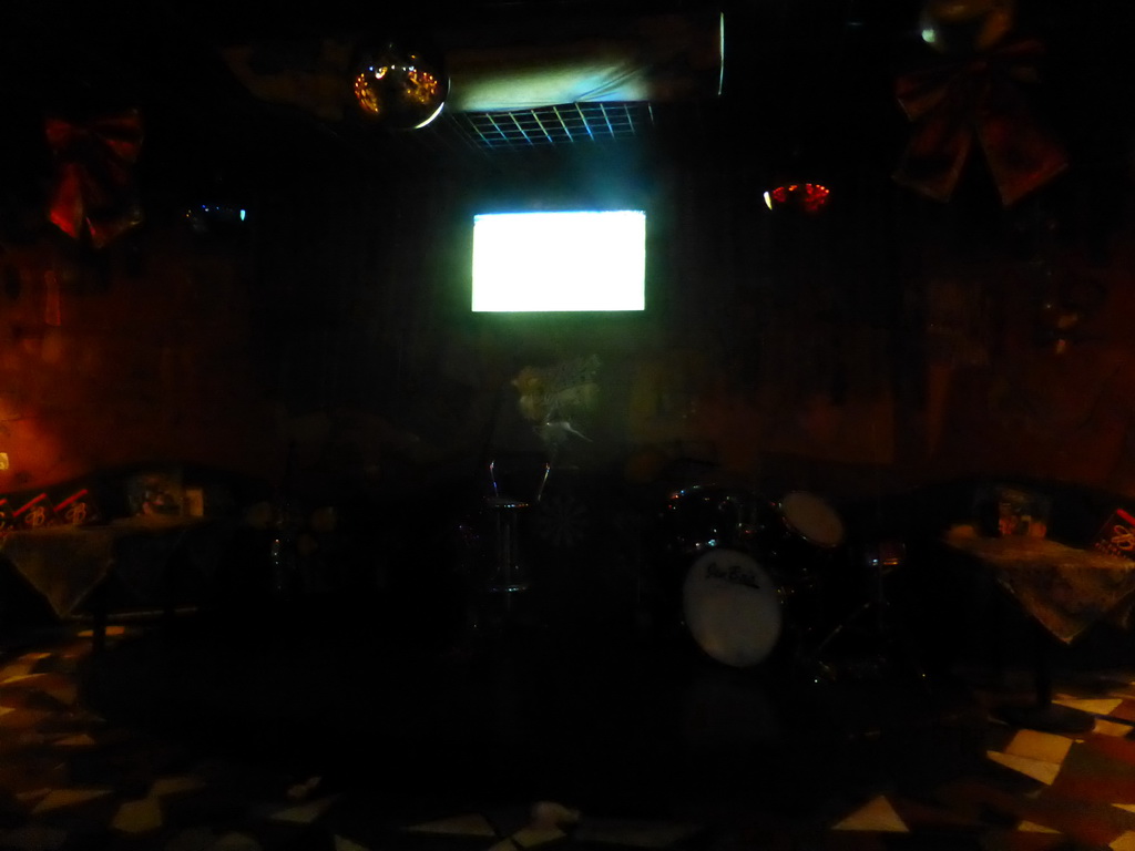 TV screen with the EURO 2016 soccer match Germany vs. Italy and drum set in a pub at Hufang Road