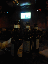 TV screen with the EURO 2016 soccer match Germany vs. Italy and Hoegaarden beers in a pub at Hufang Road