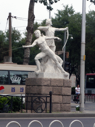 Statues of a fencer and an archer for the 2008 Olympics, viewed from the car at the Tiyuguan Road