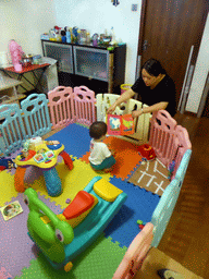 Miaomiao and Max playing with toys in the apartment of Miaomiao`s cousin