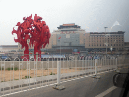 Piece of art at the Beijing West Railway Station South Road and the front of the Beijing West Railway Station, viewed from the car