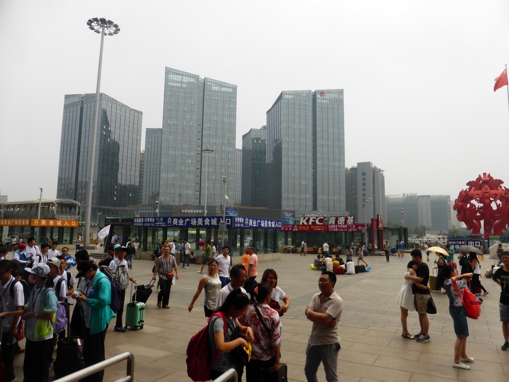 Piece of art and office buildings at the south side of the Beijing West Railway Station