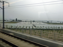 beijing_2_145 - 201 kb - 1024x768 - Greenhouses between Baoding and Shijiazhuang, viewed from the high speed train to Zhengzhou Greenhouses between Baoding and Shijiazhuang, viewed from the high speed train to Zhengzhou