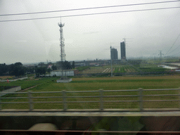Grassland and buildings at the south side of Shijiazhuang, viewed from the high speed train to Zhengzhou
