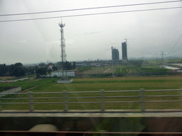 beijing_2_152 - 193 kb - 1024x768 - Grassland and buildings at the south side of Shijiazhuang, viewed from the high speed train to Zhengzhou Grassland and buildings at the south side of Shijiazhuang, viewed from the high speed train to Zhengzhou