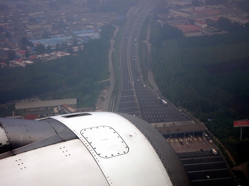 Entry to a tollroad on the east side of the city, viewed from the airplane from Dalian