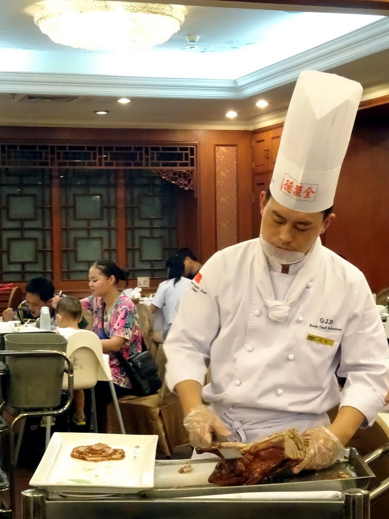 Cook preparing Beijing Duck at the Quanjude Roast Duck Restaurant
