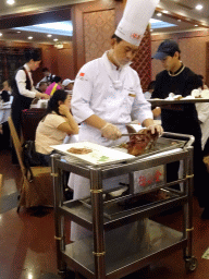 Cook preparing Beijing Duck at the Quanjude Roast Duck Restaurant