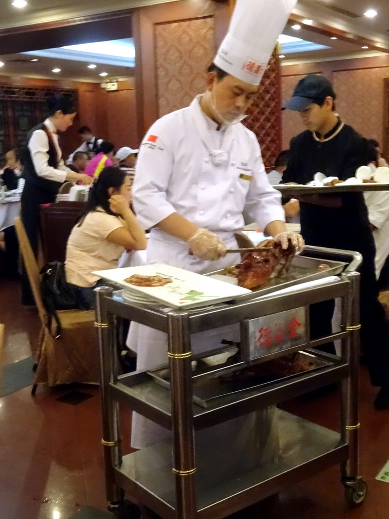 Cook preparing Beijing Duck at the Quanjude Roast Duck Restaurant