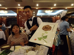 Miaomiao and a waiter with Beijing Duck at the Quanjude Roast Duck Restaurant