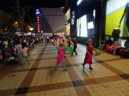 Square dancers in front of the Intime Lotte department store at Wangfujing Street, by night