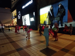Square dancers in front of the Intime Lotte department store at Wangfujing Street, by night