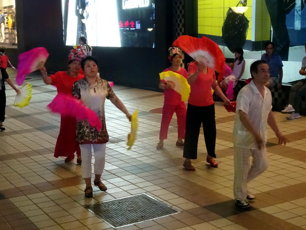 Square dancers in front of the Intime Lotte department store at Wangfujing Street, by night