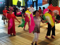 Square dancers in front of the Intime Lotte department store at Wangfujing Street, by night