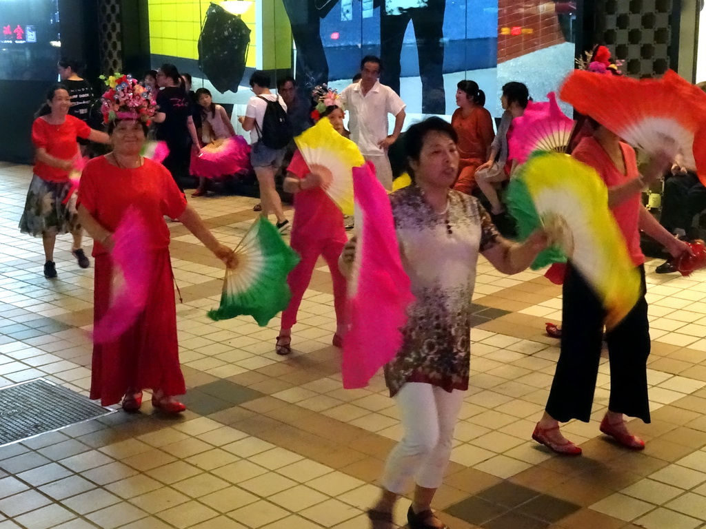 Square dancers in front of the Intime Lotte department store at Wangfujing Street, by night