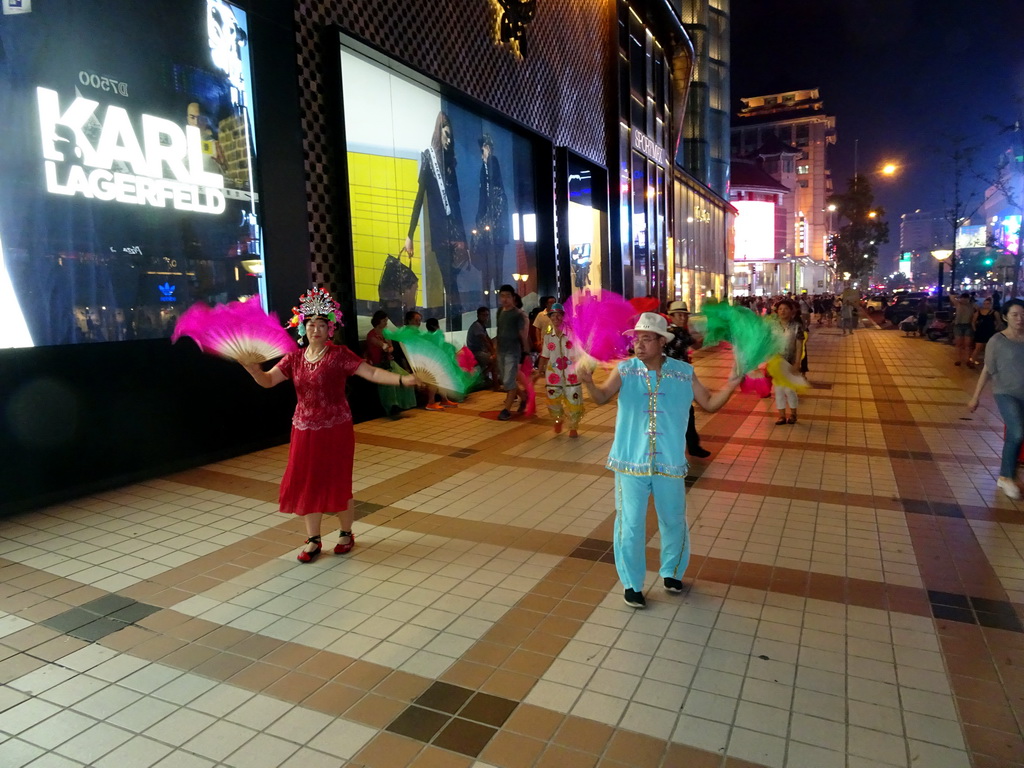 Square dancers in front of the Intime Lotte department store at Wangfujing Street, by night