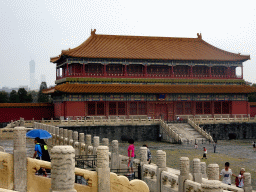 The Pavilion of Embodying Benevolence at the Forbidden City and skyscrapers in the city center, viewed from the staircase to the Hall of Supreme Harmony