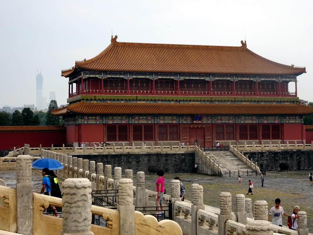 The Pavilion of Embodying Benevolence at the Forbidden City and skyscrapers in the city center, viewed from the staircase to the Hall of Supreme Harmony