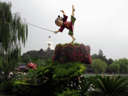 Statue and Jade Flower Island with the White Pagoda at Beihai Park