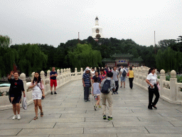 The Yong`an Bridge leading to the Jade Flower Island with the Duiyun Gate and the White Pagoda at Beihai Park