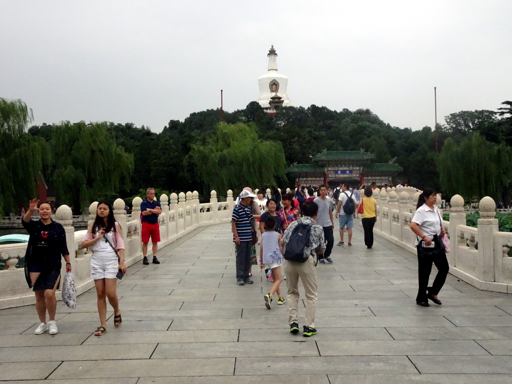 The Yong`an Bridge leading to the Jade Flower Island with the Duiyun Gate and the White Pagoda at Beihai Park
