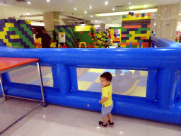 Max in front of a playground at the Intime Lotte department store