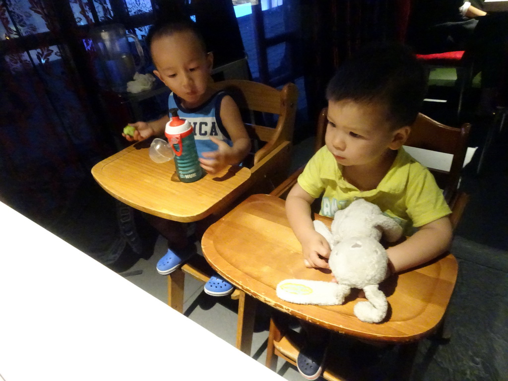 Max and his cousin in a restaurant at the Intime Lotte department store