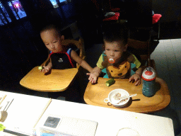 Max and his cousin in a restaurant at the Intime Lotte department store