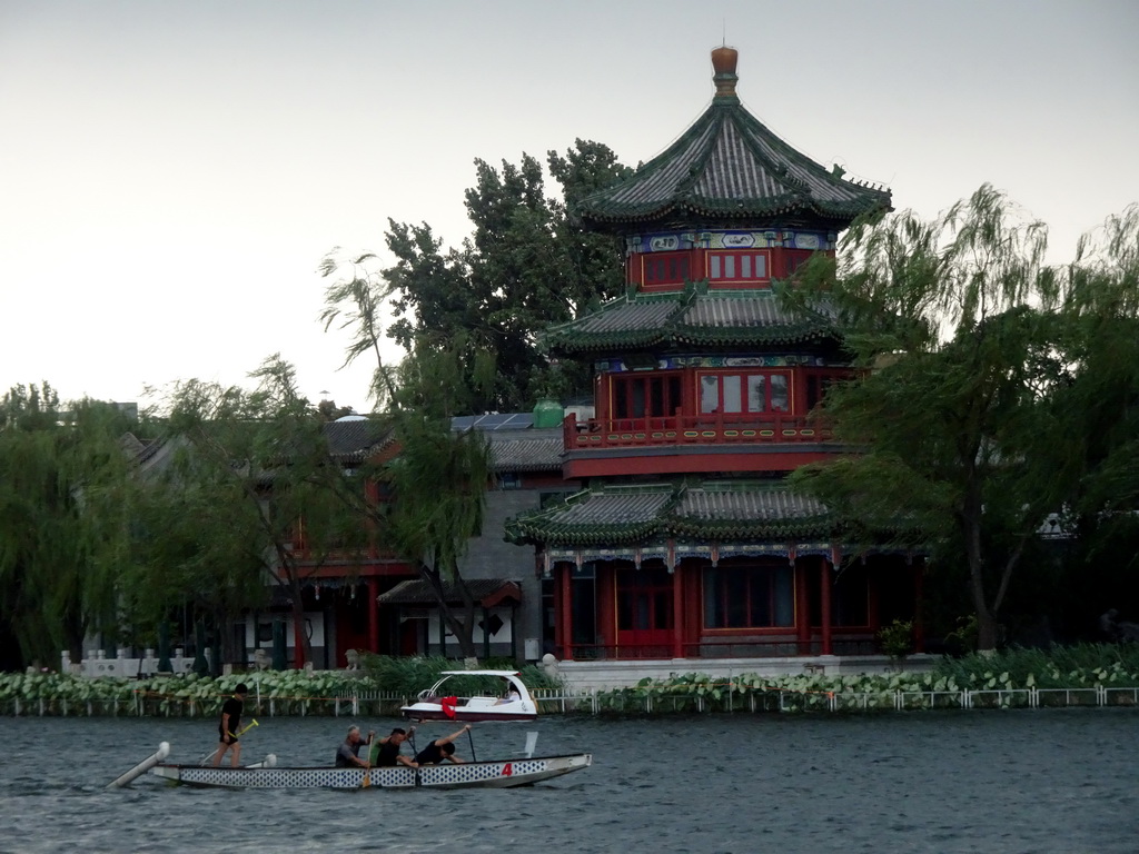 Canoe at Houhai Lake and the pavilion at the Houhai Beiyan street, viewed from the Houhai Nanyan street