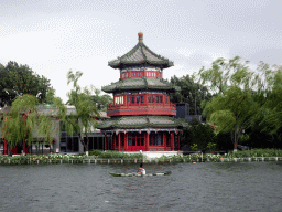 Canoe at Houhai Lake and the pavilion at the Houhai Beiyan street, viewed from the Houhai Nanyan street