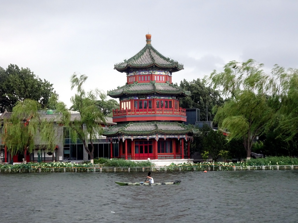 Canoe at Houhai Lake and the pavilion at the Houhai Beiyan street, viewed from the Houhai Nanyan street