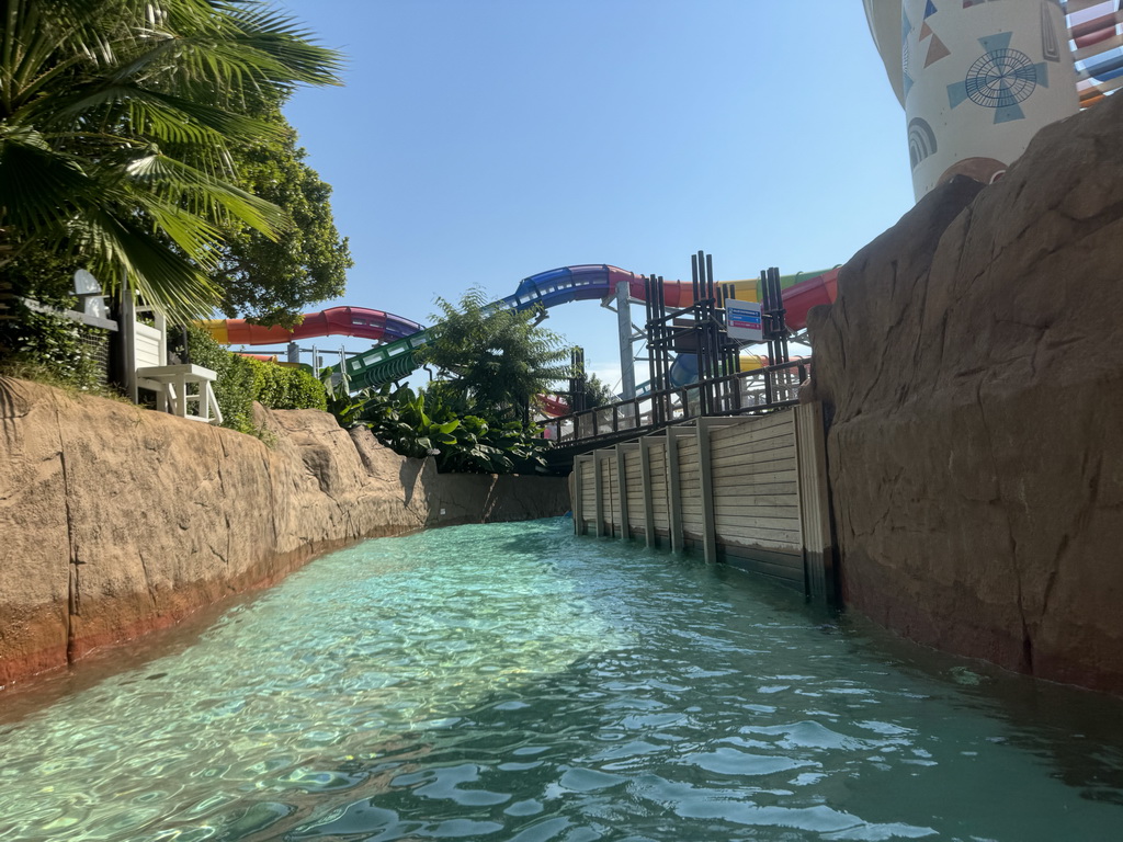 Bridge and the Turtle Coaster attraction hanging over the Wild River attraction at the Aqua Land area of the Land of Legends theme park, viewed from a tube