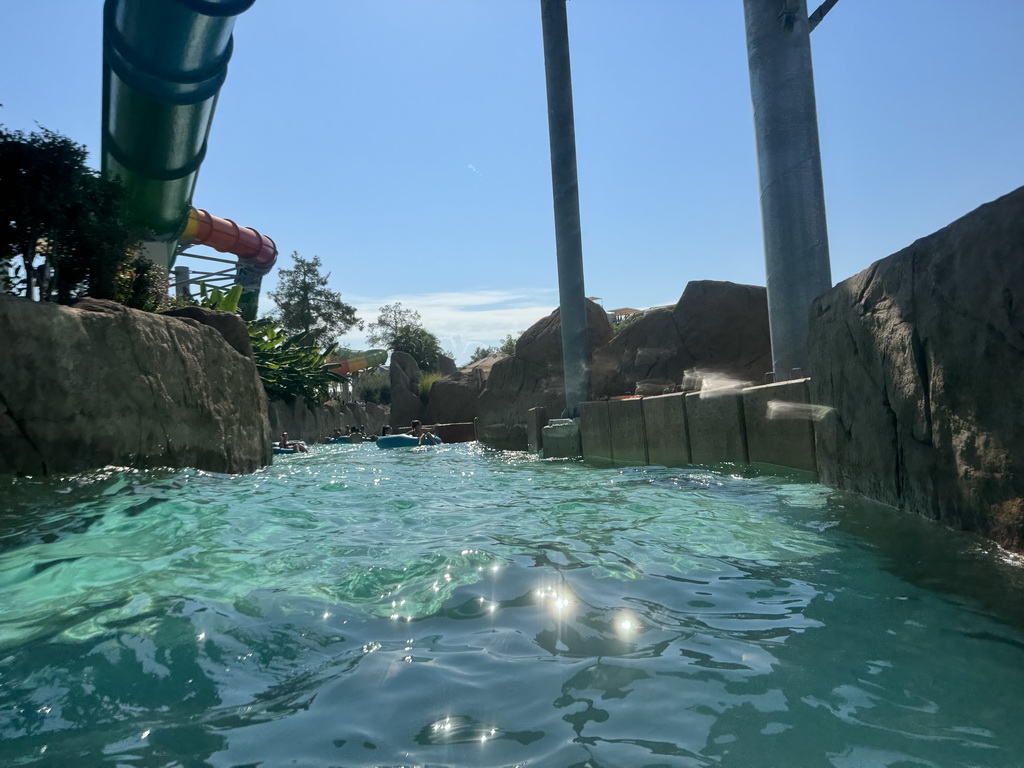 The Turtle Coaster attraction hanging over the Wild River attraction at the Aqua Land area of the Land of Legends theme park, viewed from a tube