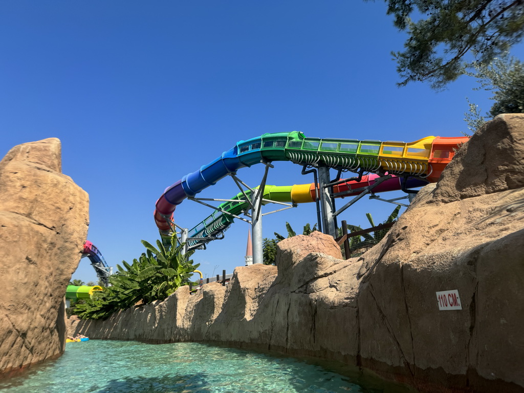 The Turtle Coaster and the Wild River attractions at the Aqua Land area of the Land of Legends theme park, viewed from a tube