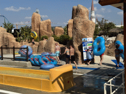 Miaomiao and Max with a tube walking to the start of the Tower Falls attraction at the Aqua Land area of the Land of Legends theme park