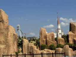 The Typhoon Coaster attraction at the Adventure Land area and the Chateau at the Shopping Avenue area of the Land of Legends theme park, viewed from the front of the Tower Falls attraction at the Aqua Land area