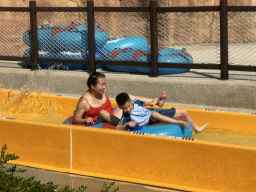 Miaomiao and Max in a tube at the bottom of the Tower Falls attraction at the Aqua Land area of the Land of Legends theme park