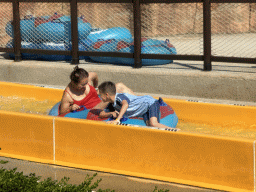 Miaomiao and Max in a tube at the bottom of the Tower Falls attraction at the Aqua Land area of the Land of Legends theme park