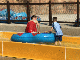 Miaomiao and Max in a tube at the bottom of the Tower Falls attraction at the Aqua Land area of the Land of Legends theme park