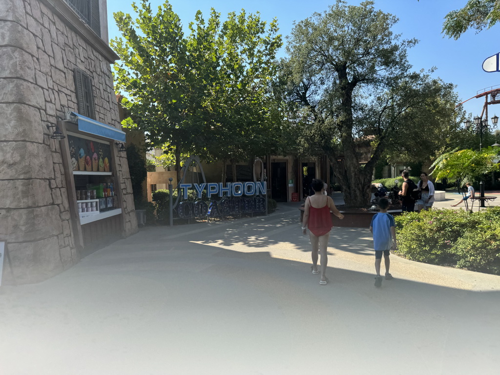 Miaomiao and Max in front of the Typhoon Coaster attraction at the Adventure Land area of the Land of Legends theme park