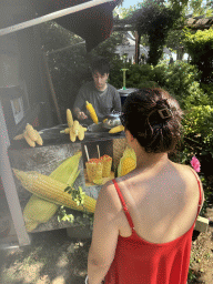 Miaomiao buying corn at the Adventure Land area of the Land of Legends theme park