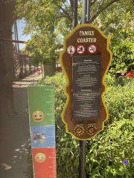 Miaomiao and a sign in front of the Family Coaster attraction at the Adventure Land area of the Land of Legends theme park