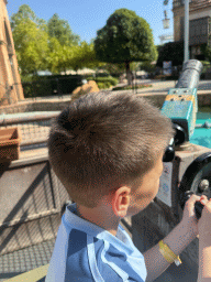 Max at a boat of the Watermania attraction at the Adventure Land area of the Land of Legends theme park