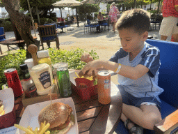 Max having lunch at the Burger Stop restaurant at the Adventure Land area of the Land of Legends theme park