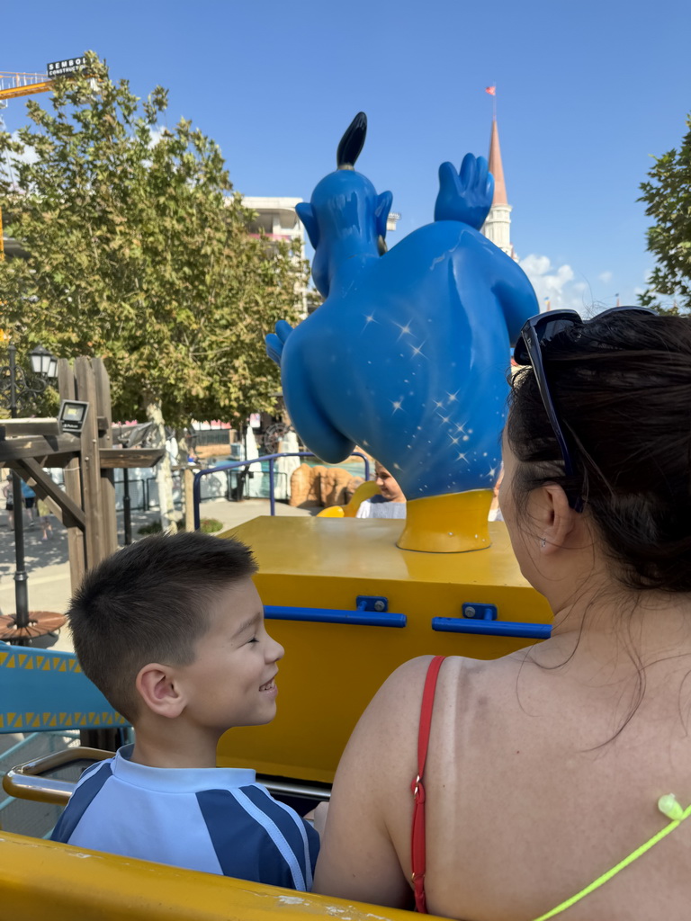 Miaomiao and Max at the Flying Carpet attraction at the Adventure Land area of the Land of Legends theme park